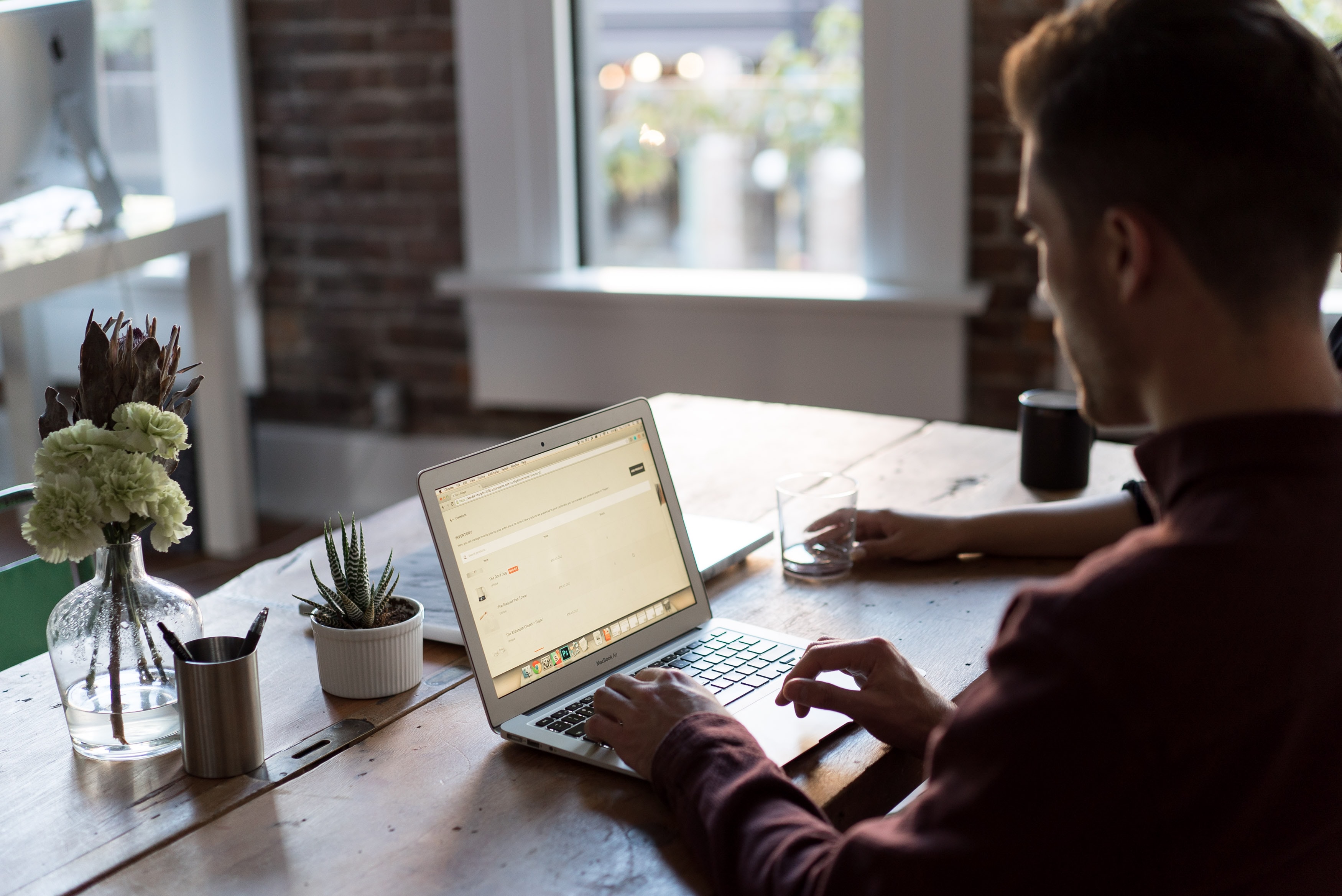 man working on laptop at desk